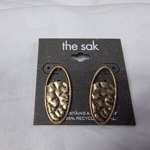 The Sak gold-tone, oval, teardrop shape with a textured, bubble pebble design